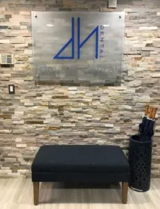 Day Hill Dental Office entrance with stool and logo picture on wall